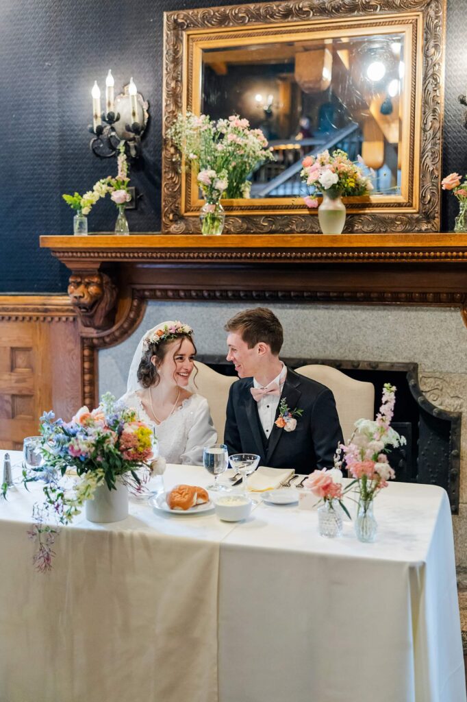 Bride & Groom smile during their reception at the Glover Mansion Wedding Venue 