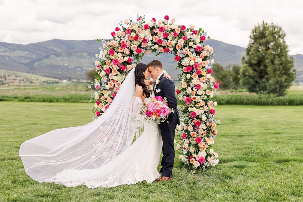 Bride & Groom portrait under the wedding arch