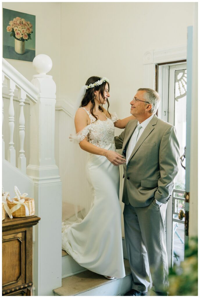 A bride's first look moment with her dad before her wedding ceremony