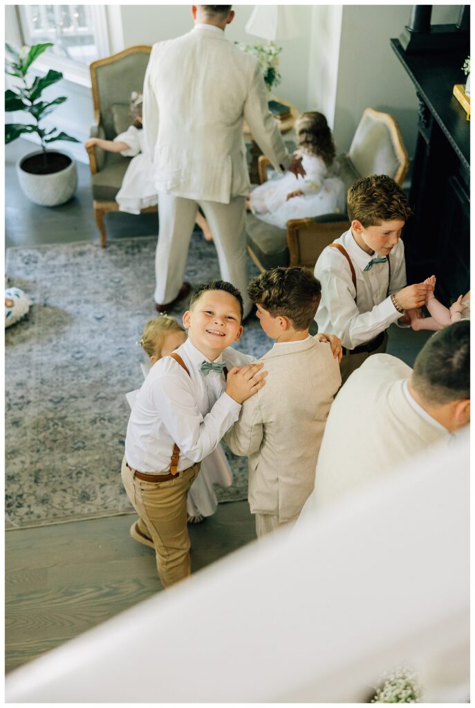 Family gathering in the living room of the Belle Gardens Venue 